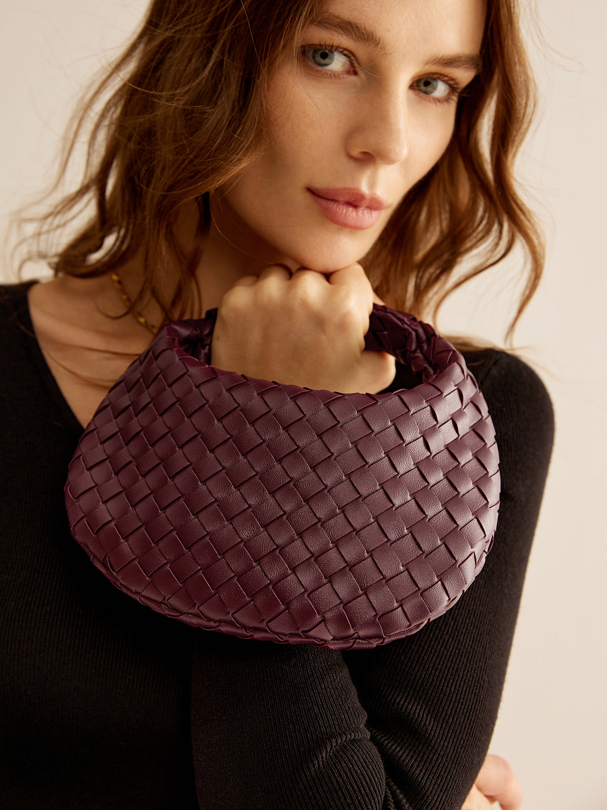Petit sac à main zippé en tissu arrondi